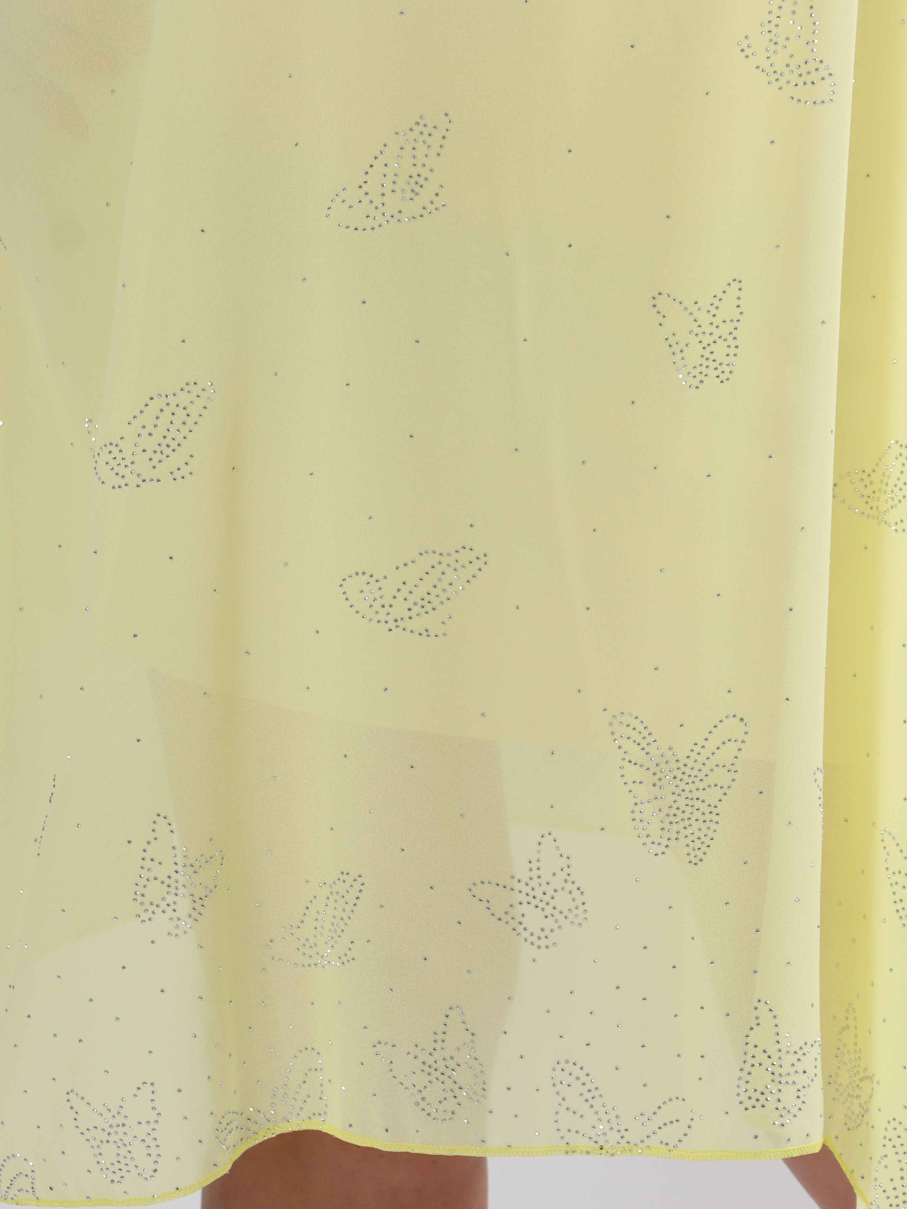 Mirabella Crystal - Tunikaklänning i plus size med chiffonglager och skenbart släp